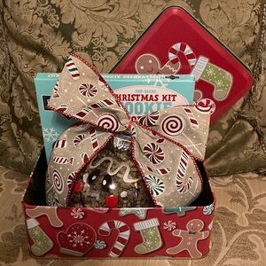 Gingerbread gift tin. Contains a gingerbread ornament and cookie decorating kit.